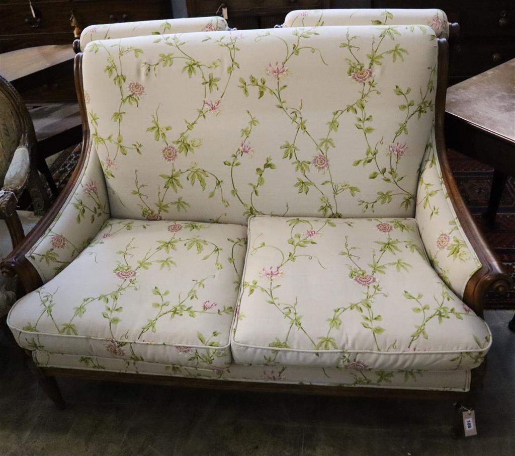 A Wesley Barrell French style three-piece carved and moulded cherrywood-frame suite with floral upholstery, settee length 140cm, height